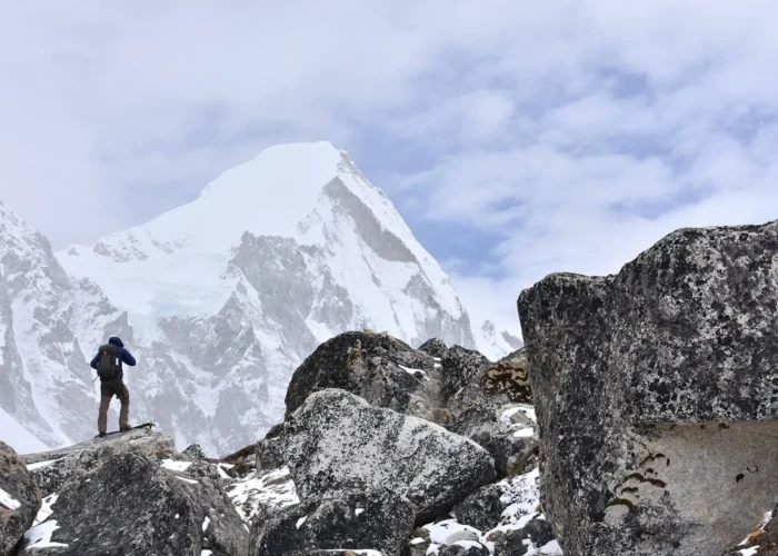An adventurous trekker mesmerized by the grandeur of Mt Everest on Everest Base Camp Trek in Nepal in winters