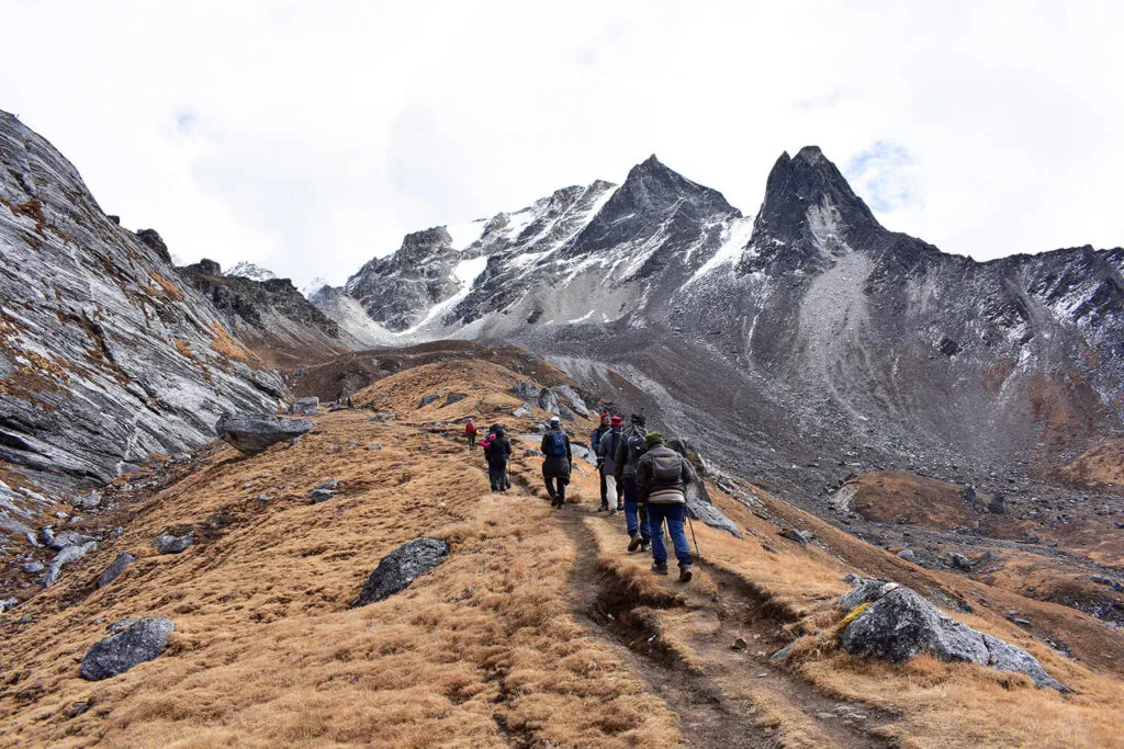Trekkers climbing the Khopra Ridge trek in October