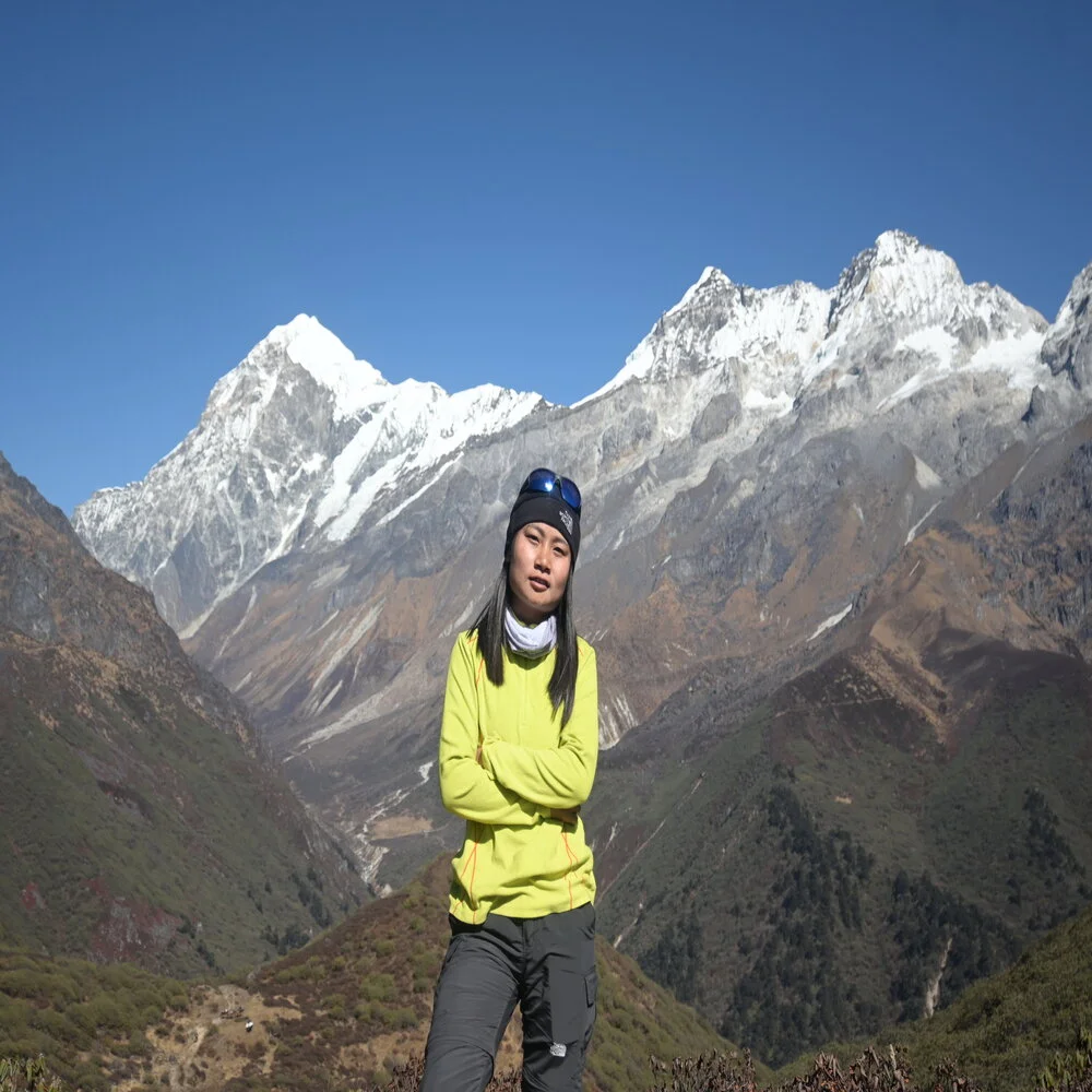 Mountaineer Neha Rai from Sikkim in front of snow studded peaks during one of her expedition. 