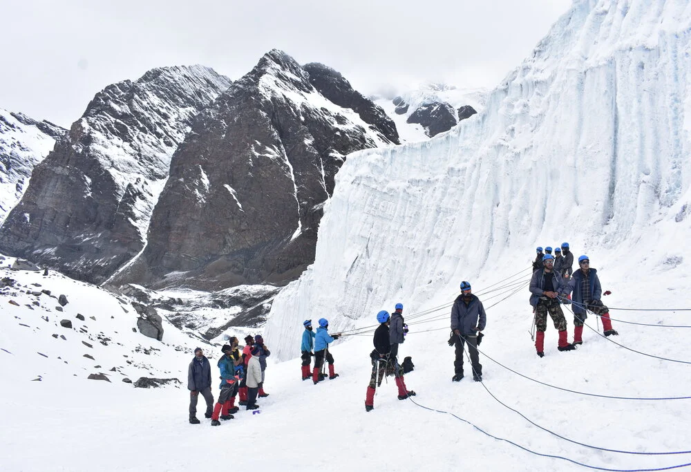 Mountaineering trainee prepares for a lesson on Ice Craft Training in Meerathang Glacier in Arunachal Pradesh