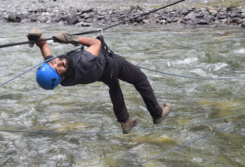 Mountaineering course  trainee in river crossing activity. 